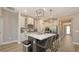 Modern kitchen features a large island, stainless steel appliances, and pendant lighting at 3803 Savanna Palms Ct, Bradenton, FL 34211