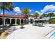 Community pool with umbrellas and seating at 3803 Savanna Palms Ct, Bradenton, FL 34211