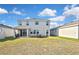The home features an expansive backyard, ideal for outdoor gatherings, with views of lush surroundings and neighboring homes at 3813 Lively Coral Pl, Bradenton, FL 34208