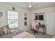 Cozy bedroom featuring a ceiling fan, plush bedding, and ample natural light at 3813 Lively Coral Pl, Bradenton, FL 34208