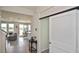 Bright foyer leading to the living room, showcasing tile flooring and an open layout at 3813 Lively Coral Pl, Bradenton, FL 34208