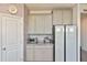 Kitchen features light gray cabinets, stainless steel appliances, and granite countertops at 3813 Lively Coral Pl, Bradenton, FL 34208