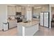 Bright open kitchen features gray cabinets, stainless appliances, granite counters and tile flooring at 3813 Lively Coral Pl, Bradenton, FL 34208
