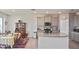Modern kitchen featuring granite countertops, stainless steel appliances, and a stylish backsplash at 3813 Lively Coral Pl, Bradenton, FL 34208