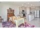 Bright kitchen and dining area with gray cabinets, stainless appliances, and a large island at 3813 Lively Coral Pl, Bradenton, FL 34208