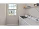 Bright laundry room featuring a new washer and dryer, with ample space at 3813 Lively Coral Pl, Bradenton, FL 34208