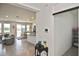 Open living room with tile floors, view of kitchen, and sliding glass doors to the backyard at 3813 Lively Coral Pl, Bradenton, FL 34208