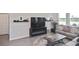 Comfortable living room features a fireplace, tile floors, and large windows at 3813 Lively Coral Pl, Bradenton, FL 34208