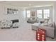 Upstairs loft area with plush carpeting and comfortable seating, perfect for a relaxing space at 3813 Lively Coral Pl, Bradenton, FL 34208