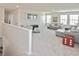 Upstairs loft area with plush carpeting and comfortable seating, perfect for a relaxing space at 3813 Lively Coral Pl, Bradenton, FL 34208