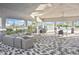 Community pool area with ample seating and shade, perfect for relaxing by the water at 3813 Lively Coral Pl, Bradenton, FL 34208