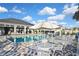 The pool area offers comfortable seating, shade, and a welcoming atmosphere, ideal for relaxation and enjoying the sunny weather at 3813 Lively Coral Pl, Bradenton, FL 34208