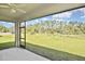 Enjoy a relaxing outdoor space with a screened patio overlooking the spacious green backyard at 3836 Wenona Dr, North Port, FL 34288