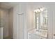 Bathroom featuring single sink vanity with marble countertop and tiled walk-in shower at 3836 Wenona Dr, North Port, FL 34288