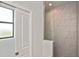 Bathroom featuring tiled walk-in shower at 3836 Wenona Dr, North Port, FL 34288