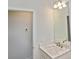 A well-lit bathroom features a stylish vanity with marble countertop, and modern lighting at 3836 Wenona Dr, North Port, FL 34288