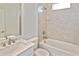 Bright bathroom featuring a tub, shower, and a modern vanity with a marble countertop at 3836 Wenona Dr, North Port, FL 34288