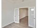 Bright bedroom featuring modern gray floors, neutral paint, and french doors for a clean aesthetic at 3836 Wenona Dr, North Port, FL 34288