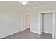 Bedroom features ceiling fan, walk-in closet, and an en suite bath for added privacy at 3836 Wenona Dr, North Port, FL 34288