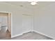 This bedroom offers a neutral color palette, ceiling fan, and wide closet for essential storage at 3836 Wenona Dr, North Port, FL 34288