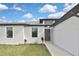 Close up of the home's front exterior showing the main entrance at 3836 Wenona Dr, North Port, FL 34288