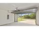 This garage features an automatic door, cement floor, and a view to the exterior at 3836 Wenona Dr, North Port, FL 34288