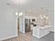 Modern kitchen features a center island and stainless steel appliances at 3836 Wenona Dr, North Port, FL 34288