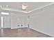 Bright open-concept living area with wood floors and recessed lighting at 3836 Wenona Dr, North Port, FL 34288