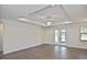Open-concept living area with wood floors and recessed lighting at 3836 Wenona Dr, North Port, FL 34288