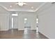 Bright open-concept living area with wood floors and recessed lighting at 3836 Wenona Dr, North Port, FL 34288