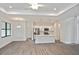 Open floor plan with modern kitchen featuring stainless steel appliances at 3836 Wenona Dr, North Port, FL 34288