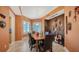 Inviting dining room features a stylish display case, comfortable seating for six, and ample natural light at 385 N Point Rd # 903, Osprey, FL 34229