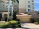 Exterior of building showing garage, landscaping, and fountain at 385 N Point Rd # 903, Osprey, FL 34229