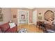 Comfortable living room featuring hardwood floors, desk area, and tasteful decorations at 385 N Point Rd # 903, Osprey, FL 34229