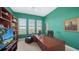 Bright office space with natural light from multiple windows and a large desk workspace at 385 N Point Rd # 903, Osprey, FL 34229