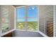 Breathtaking view from windows with plantation shutters offering a glimpse of nature and neighborhood at 385 N Point Rd # 903, Osprey, FL 34229
