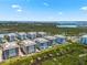 Aerial view of several condo buildings with waterfront and green landscape at 388 Aruba Cir # 103, Bradenton, FL 34209