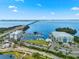 High angle view of marina, waterfront hotel, and the bridge over clear ocean waters at 388 Aruba Cir # 103, Bradenton, FL 34209