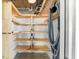 Unfinished basement area with shelving, storage solutions, and ample space for organization at 388 Aruba Cir # 103, Bradenton, FL 34209