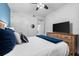 Bedroom features wood-look floors and light walls with a TV on dresser and doorway to the bathroom at 388 Aruba Cir # 103, Bradenton, FL 34209