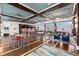Large open clubhouse with bar, lounge seating, and stylish decor at 388 Aruba Cir # 103, Bradenton, FL 34209