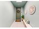 Inviting entryway with a decorative door, stylish accents, and a bench for seating with muted colors at 388 Aruba Cir # 103, Bradenton, FL 34209