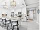 Bright kitchen with granite island, stainless steel appliances, and white cabinetry at 388 Aruba Cir # 103, Bradenton, FL 34209