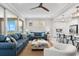 Cozy living room with a view of the water from the balcony and a modern kitchen nearby at 388 Aruba Cir # 103, Bradenton, FL 34209