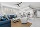 Spacious living area featuring an open floor plan to the kitchen and balcony with water views at 388 Aruba Cir # 103, Bradenton, FL 34209