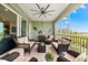 Relaxing screened-in patio with comfortable seating, waterfront views, and coastal-themed decorations at 388 Aruba Cir # 103, Bradenton, FL 34209