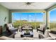 Relaxing screened-in patio with comfortable seating and beautiful waterfront views at 388 Aruba Cir # 103, Bradenton, FL 34209