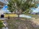 Relaxing backyard view with mature tree shading waterside property at 3909 40Th W St, Bradenton, FL 34205