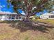 Spacious backyard with mature trees offering ample shade and tranquility for outdoor activities at 3909 40Th W St, Bradenton, FL 34205