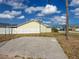 Enjoy outdoor activities on this private basketball court with a backboard, nestled beside a fenced yard under a sunny sky at 3909 40Th W St, Bradenton, FL 34205